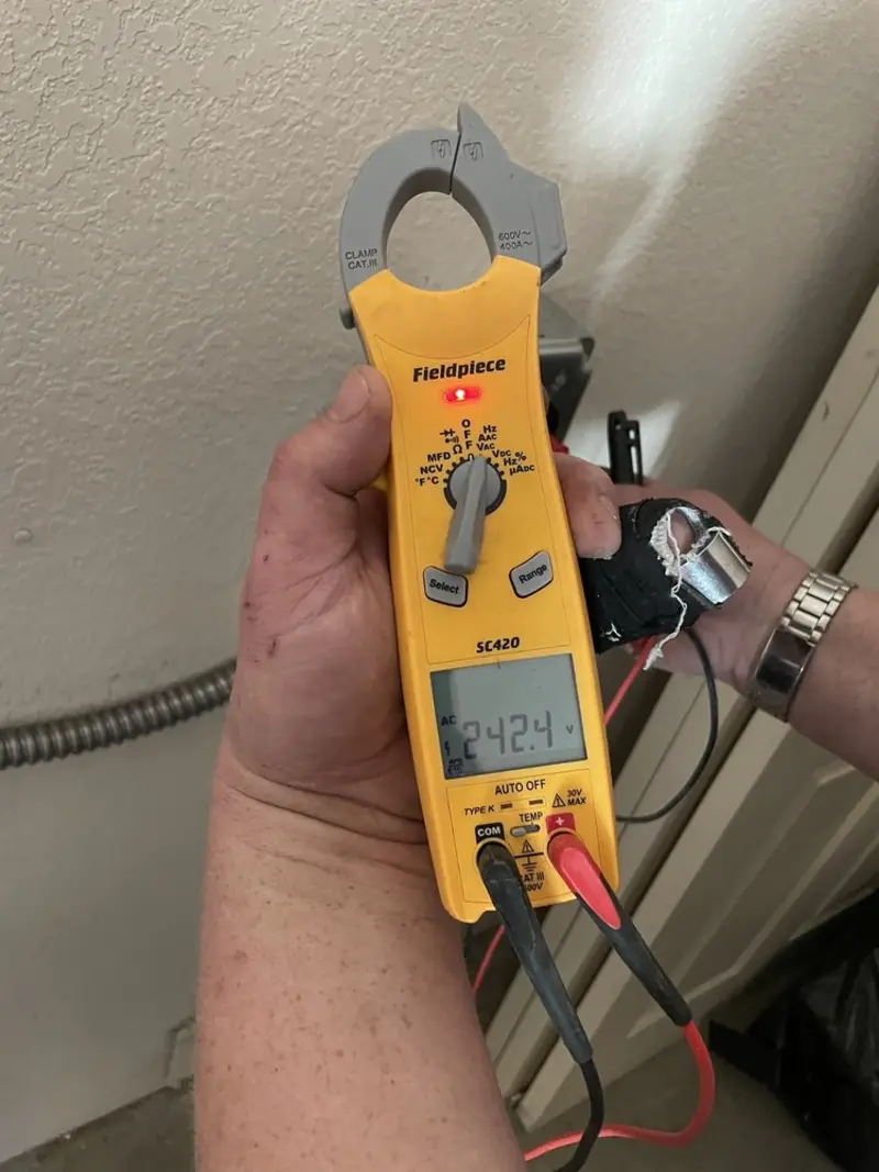 Voltage testing with clamp meter during Outlet Installation in Jersey Village